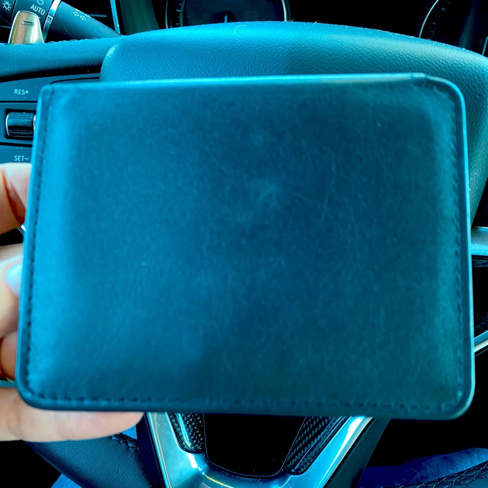 Black trifold belt loop wallet. New, never used.